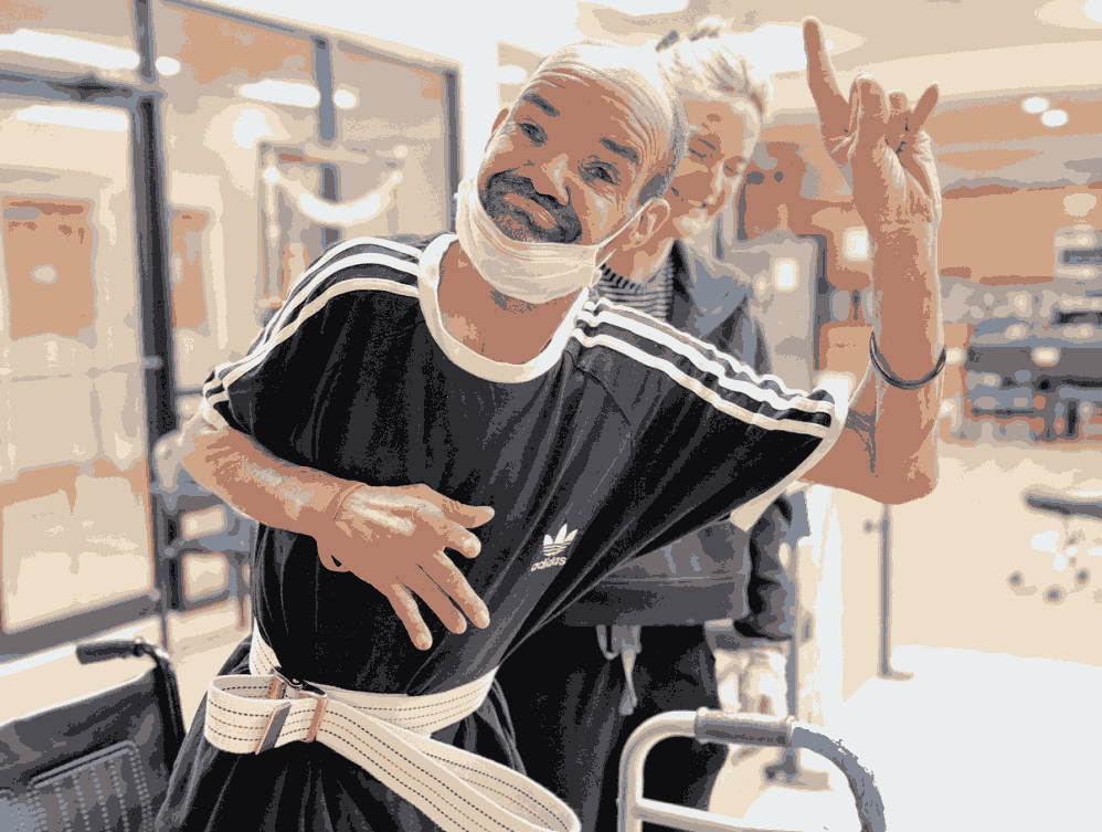 A man in a wheelchair with a bandage on his face in short-term rehab in a skilled nursing facility in Shreveport, LA